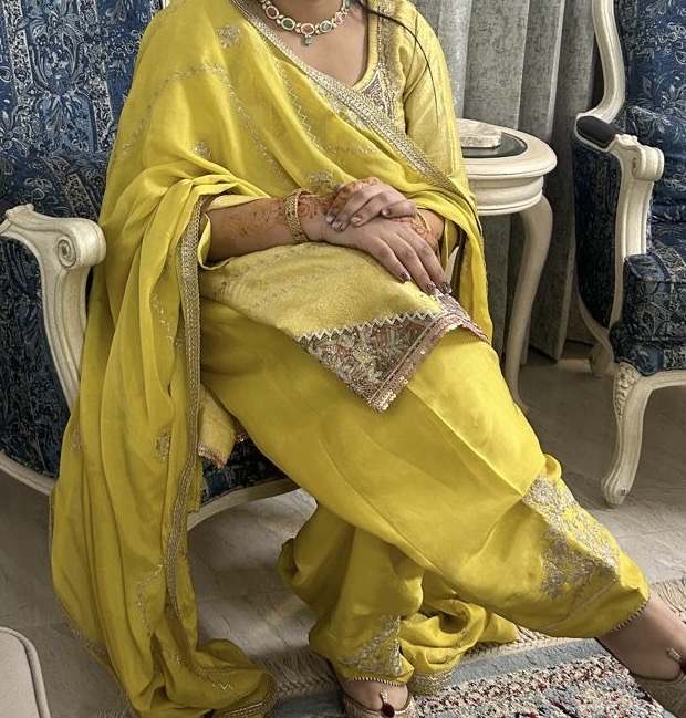 Bright yellow salwar kameez with embroidered borders and a matching dupatta