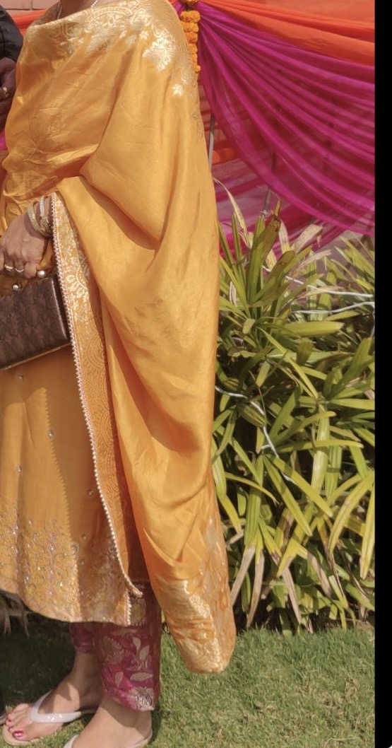 Mustard silk kameez with a banarasi dupatta and magenta brocade pants