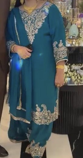 Teal kameez and salwar with silver floral embroidery and a matching dupatta